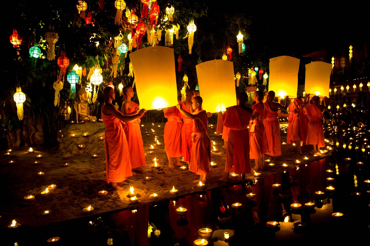 monks lighting lanterns photo