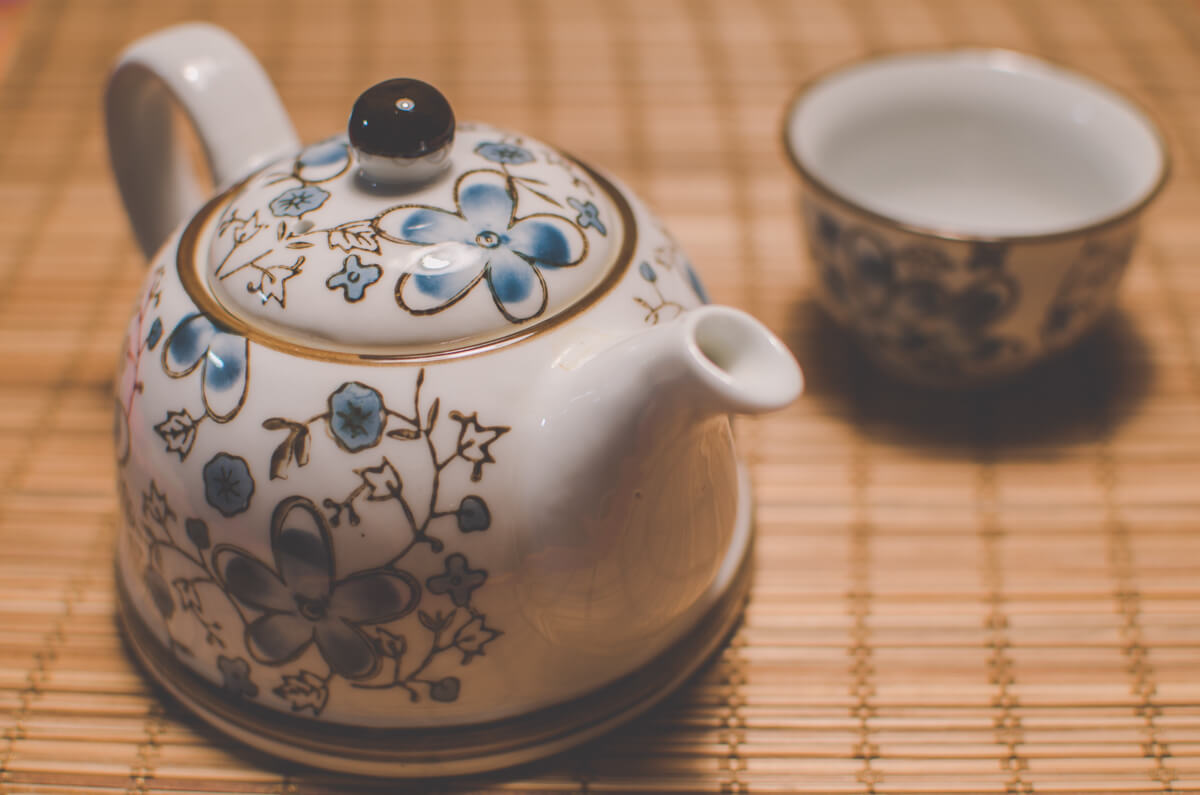 Tea pot in focus