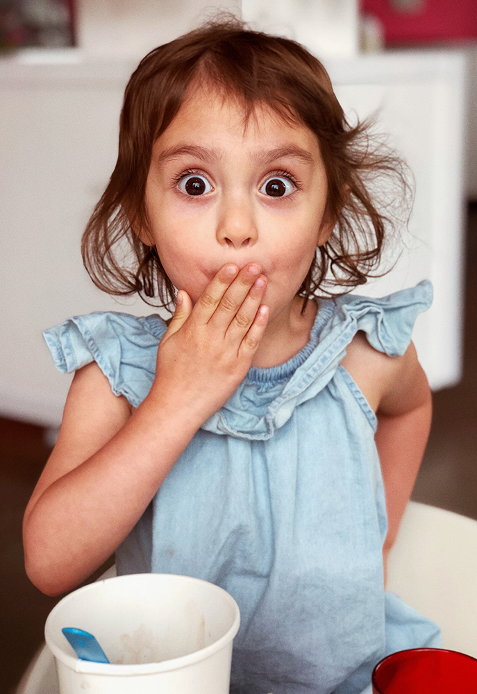 surprised girl covering her mouth